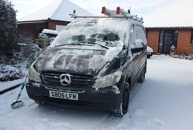 scott regan chimney sweeping van covered in snow