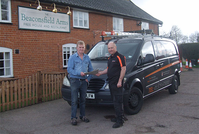 scott regan handing sweep completion certificate to customer in suffolk