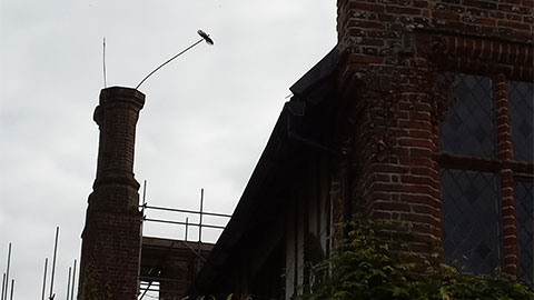 Chimney brush pushed to the top of a chimney